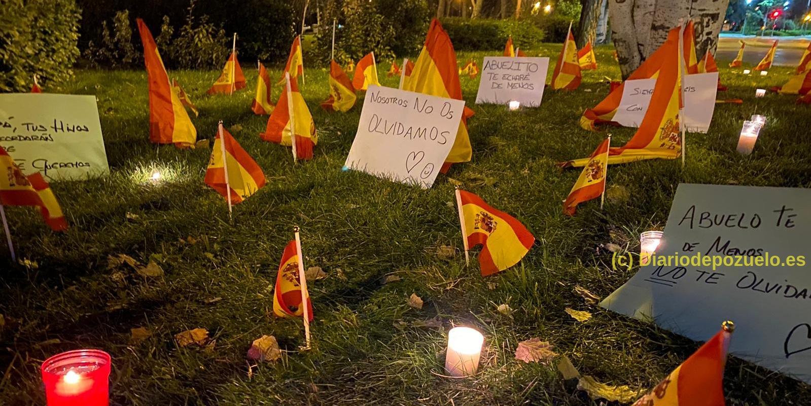 Vecinos de Pozuelo rinden homenaje a sus familiares fallecidos por el coronavirus en el parque de las Minas